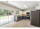 Modern kitchen with stainless steel appliances and a door to the backyard at 169 Wallnut Hall Circle, Woodstock, GA 30189