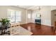 Bright and airy living room featuring hardwood floors, a work space, and ample natural light at 169 Wallnut Hall Circle, Woodstock, GA 30189