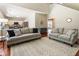 Open living room with hardwood floors and kitchen access at 169 Wallnut Hall Circle, Woodstock, GA 30189