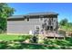 View of home exterior featuring backyard deck and lawn at 194 Saddleridge Dr, Bremen, GA 30110