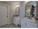 Bathroom featuring marble countertops, black faucets, and stylish tile floors at 194 Saddleridge Dr, Bremen, GA 30110