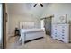 Bedroom with vaulted ceilings, carpet floors, and a decorative sliding barn door at 194 Saddleridge Dr, Bremen, GA 30110