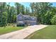 Charming two-story home features a well-manicured lawn, attached garage and lush, mature trees at 194 Saddleridge Dr, Bremen, GA 30110