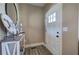 Bright foyer with wood-look floors, side table and direct access to the rest of the home at 194 Saddleridge Dr, Bremen, GA 30110