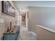 Hallway featuring neutral paint, carpet, trim, and framed artwork at 194 Saddleridge Dr, Bremen, GA 30110