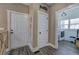 Hallway with pantry access, and door to exterior at 194 Saddleridge Dr, Bremen, GA 30110