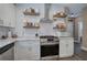 Close up of kitchen featuring stainless steel appliances, subway tile backsplash, and white cabinetry at 194 Saddleridge Dr, Bremen, GA 30110