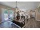 Open kitchen and dining area with stainless appliances, white cabinetry, and access to the back deck at 194 Saddleridge Dr, Bremen, GA 30110