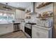 Close up of kitchen featuring stainless steel appliances, subway tile backsplash, and white cabinetry at 194 Saddleridge Dr, Bremen, GA 30110