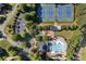 Aerial view of neighborhood amenities, including tennis courts, playground, and swimming pool at 4440 Green Summers Dr, Cumming, GA 30028