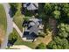 Aerial shot of the property showing the roof line, landscaping, and driveway at 4440 Green Summers Dr, Cumming, GA 30028