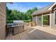 Back deck featuring a stainless grill and a relaxing screened-in porch at 4440 Green Summers Dr, Cumming, GA 30028