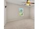 Bright bedroom featuring neutral carpet, a ceiling fan and a window at 4440 Green Summers Dr, Cumming, GA 30028