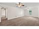 Bright primary bedroom with a ceiling fan, carpet flooring, and two closets, offering comfort and convenience at 4440 Green Summers Dr, Cumming, GA 30028