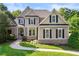 Charming two-story home with well-manicured lawn, brick accents, and inviting entrance at 4440 Green Summers Dr, Cumming, GA 30028