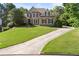 Lovely two-story home with a spacious front yard and long driveway at 4440 Green Summers Dr, Cumming, GA 30028