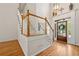 Elegant foyer with hardwood floors, staircase, and decorative chandelier at 4440 Green Summers Dr, Cumming, GA 30028