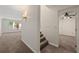 Hallway featuring carpeted floors, staircase and access to other rooms at 4440 Green Summers Dr, Cumming, GA 30028