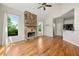 Living room with vaulted ceiling, hardwood floors, and stone fireplace at 4440 Green Summers Dr, Cumming, GA 30028