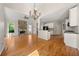 Large living room with vaulted ceilings, hardwood floors, and open concept to kitchen at 4440 Green Summers Dr, Cumming, GA 30028