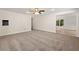 Large carpeted living room offering flexible layout options and featuring a ceiling fan at 4440 Green Summers Dr, Cumming, GA 30028