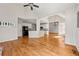 Spacious living area with hardwood floors, stone fireplace, open to kitchen at 4440 Green Summers Dr, Cumming, GA 30028