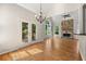 Living room and breakfast nook with beautiful doors to outdoor deck and stone fireplace at 4440 Green Summers Dr, Cumming, GA 30028