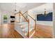 Open-concept living space featuring hardwood floors and view of dining room at 4440 Green Summers Dr, Cumming, GA 30028
