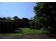 Expansive backyard featuring a secure chain-link fence, offering ample space and privacy at 1621 Oak Rd, Snellville, GA 30078