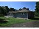 Charming single-story home with a well-maintained lawn and concrete patio, perfect for outdoor relaxation at 1621 Oak Rd, Snellville, GA 30078