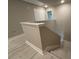 Upstairs hallway with gray colored walls and light hardwood-style floors at 338 Cherryhill Ln, Woodstock, GA 30188