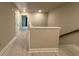 A wide, bright hallway featuring wood floors and doors at 338 Cherryhill Ln, Woodstock, GA 30188