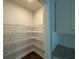 Walk-in pantry with wire shelving and ample storage space at 338 Cherryhill Ln, Woodstock, GA 30188