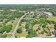 Aerial image showcasing a property with its green surroundings and nearby shopping centers at 3388 Hamilton Mill Rd, Buford, GA 30519