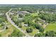 A high angle shot of the property, showing the street, the nearby amenities and neighborhood at 3388 Hamilton Mill Rd, Buford, GA 30519