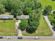 Overhead view of the residence, displaying the house, large lawn, shed, and adjacent roads and greenery at 3388 Hamilton Mill Rd, Buford, GA 30519
