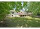 Expansive backyard with a well-maintained lawn and a wooden deck perfect for outdoor entertaining at 3388 Hamilton Mill Rd, Buford, GA 30519