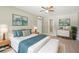Staged bedroom showcasing a comfortable bed, stylish decor, and light wood flooring at 3388 Hamilton Mill Rd, Buford, GA 30519