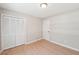 The bedroom features wooden floors, with ample closet space, and neutral walls with classic white trim at 3388 Hamilton Mill Rd, Buford, GA 30519