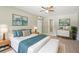 Staged bedroom showcasing a comfortable bed, stylish decor, and light wood flooring at 3388 Hamilton Mill Rd, Buford, GA 30519