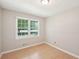 Bright bedroom with a large window and neutral walls at 3388 Hamilton Mill Rd, Buford, GA 30519