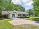 Charming exterior view of the home with a porch and driveway at 3388 Hamilton Mill Rd, Buford, GA 30519