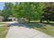 Exterior view of the home, driveway, and front yard at 3388 Hamilton Mill Rd, Buford, GA 30519