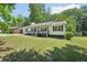 Exterior view of the home and the large front yard at 3388 Hamilton Mill Rd, Buford, GA 30519