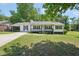 Charming one-story home with a welcoming front porch and beautifully maintained front yard at 3388 Hamilton Mill Rd, Buford, GA 30519