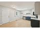 Well-lit kitchen featuring white cabinets, stainless steel appliances, and light wood floors at 3388 Hamilton Mill Rd, Buford, GA 30519