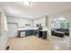 Updated kitchen with an open layout, white cabinets, and stainless steel appliances at 3388 Hamilton Mill Rd, Buford, GA 30519