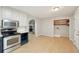 Kitchen with stainless appliances and access to an adjoining laundry room at 3388 Hamilton Mill Rd, Buford, GA 30519