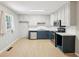 Bright kitchen with stainless appliances, white cabinets, and updated countertops at 3388 Hamilton Mill Rd, Buford, GA 30519