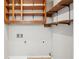 A utility area featuring wooden storage and shelving in a compact room at 3388 Hamilton Mill Rd, Buford, GA 30519